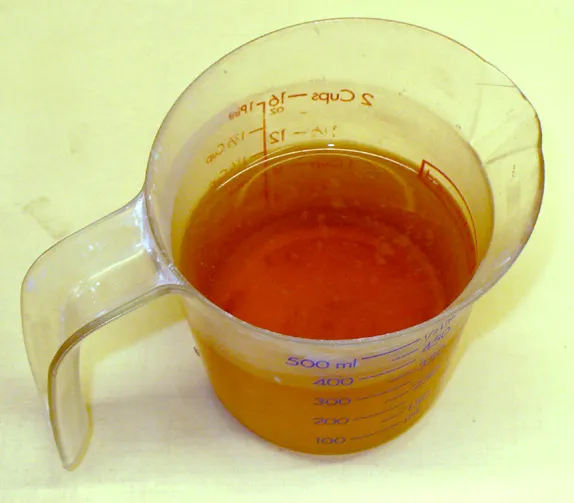 Should you throw out the brown water on top of settled glazes?