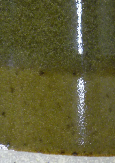 Close-up of cone 10R celadon bubbles suspended in the glass