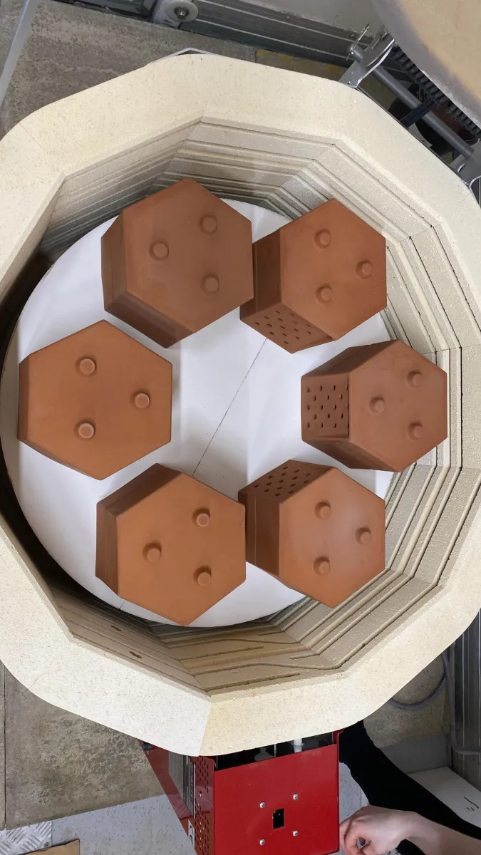 Hexagonal terra cotta planters in an electric kiln