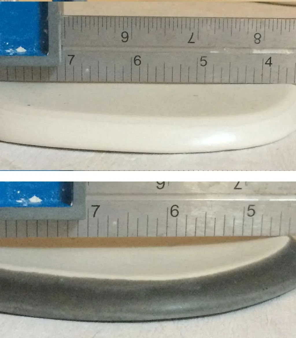 A high expansion glaze is bowing the foot of the bottom bowl