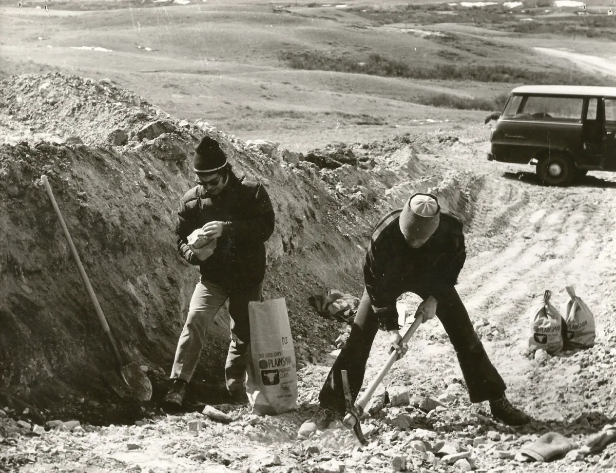 John Porter and Luke Lindoe taking lump clay samples from the side of a hill in southern Saskatchewa