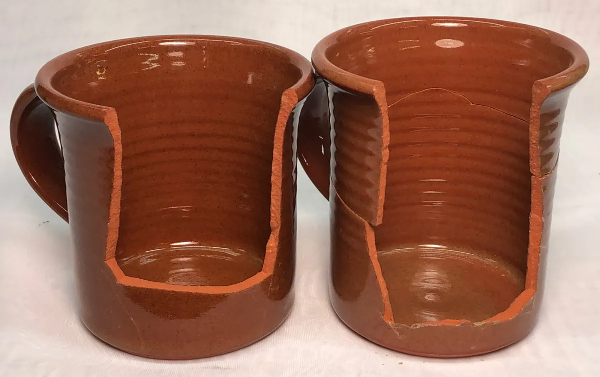 Two clear glazed terra cotta mugs