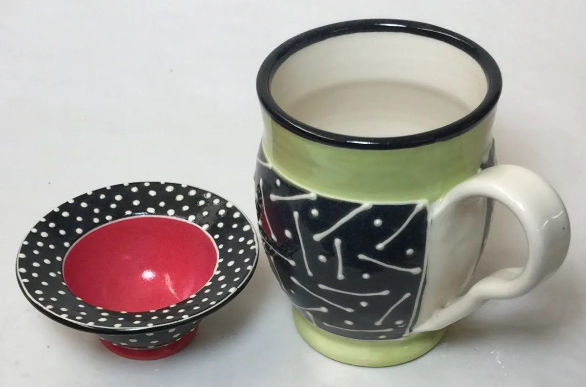 Cone 6 porcelain decorated via slip trailing