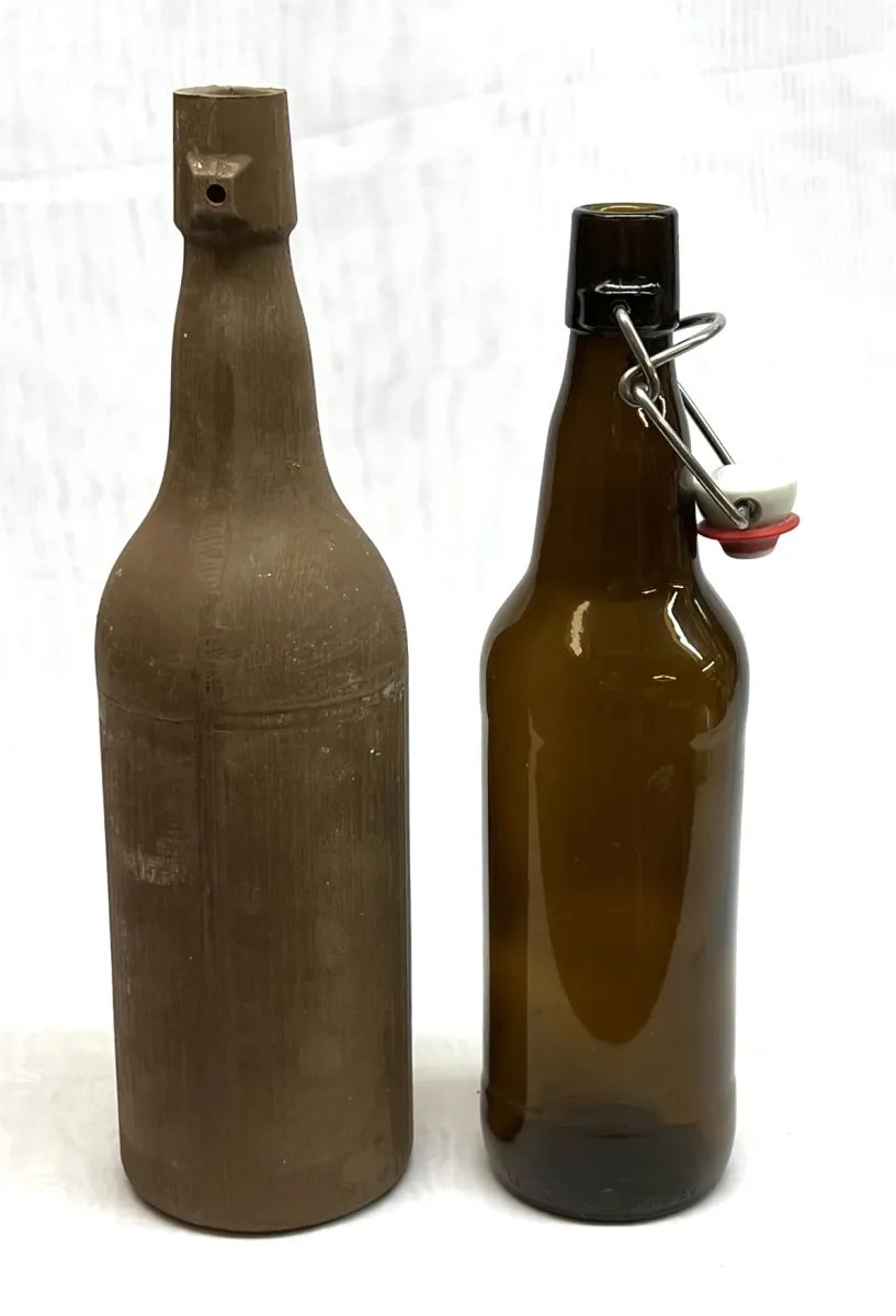 Slip cast beer bottle
