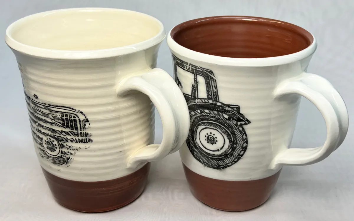 Two terra cotta mugs