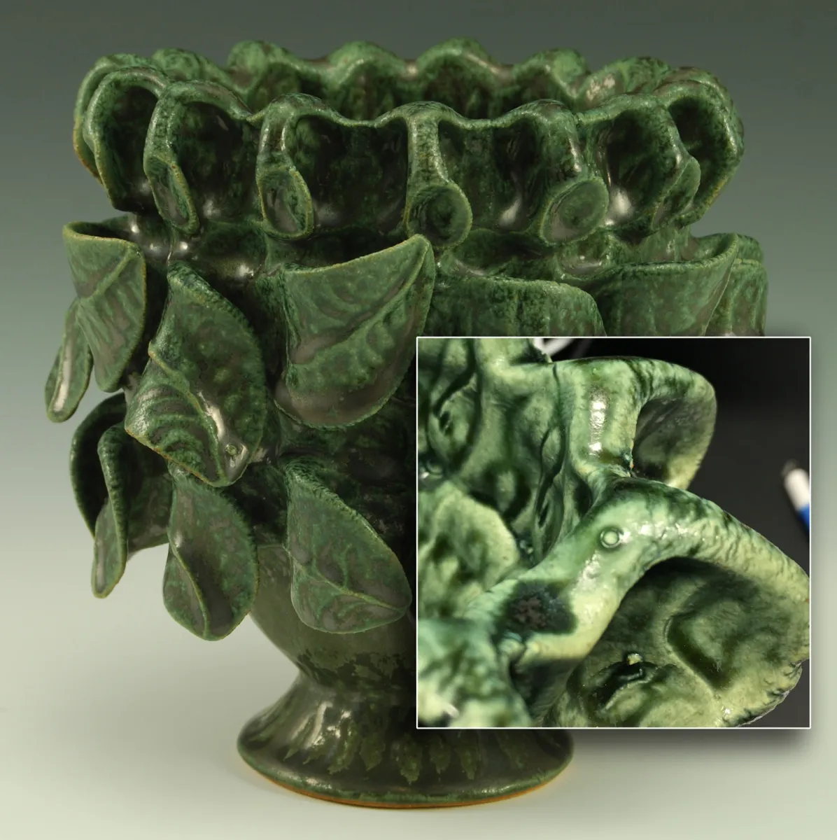 A copper sculpture glaze is blistering