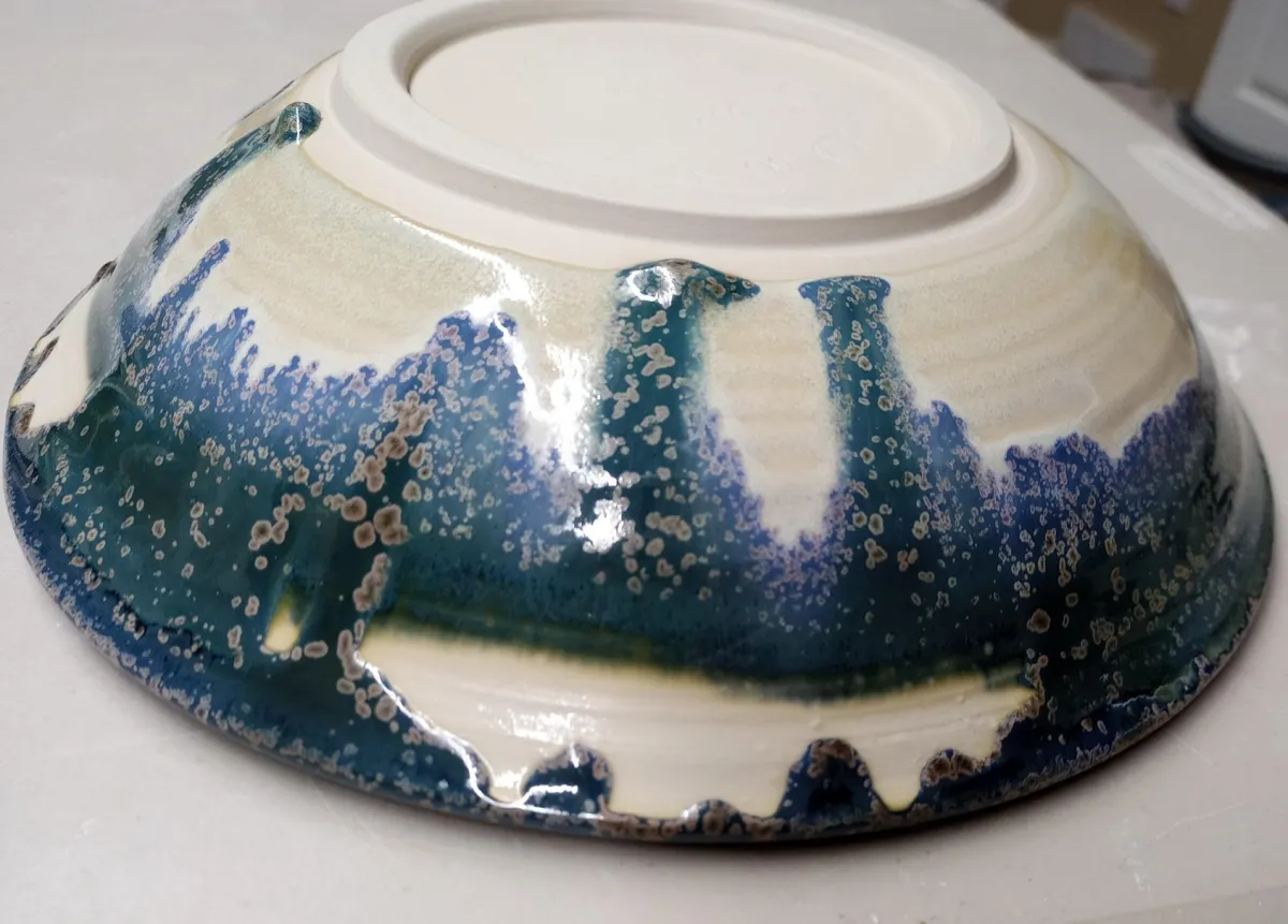 Dipping glaze crawling because of layering