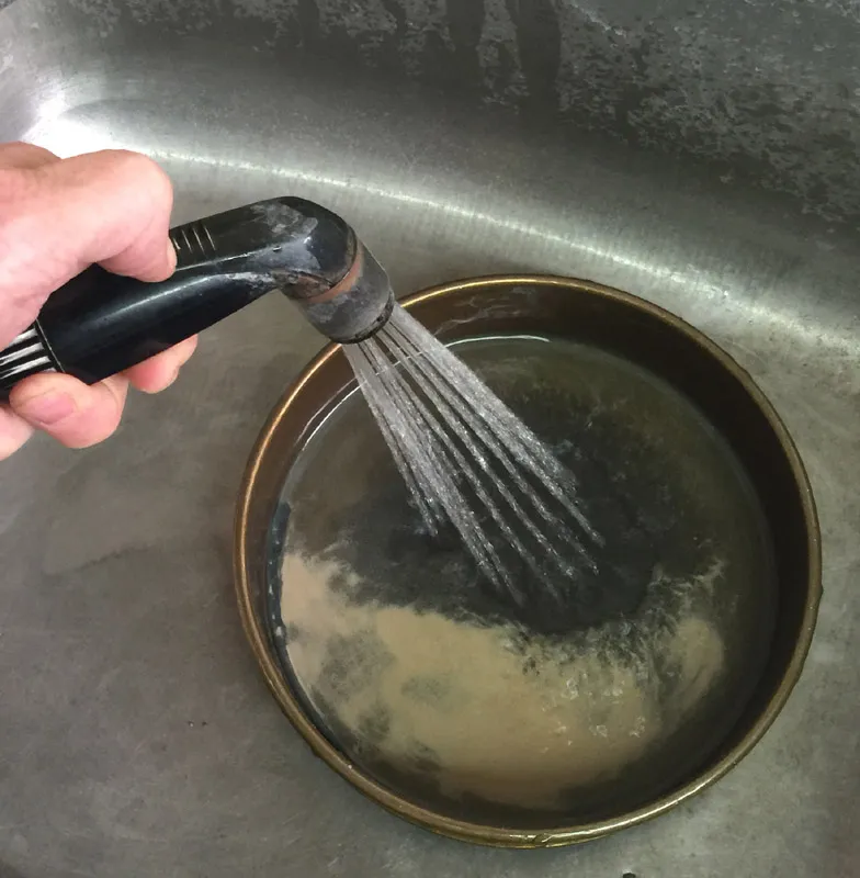 Washing clay through a 200 mesh sieve