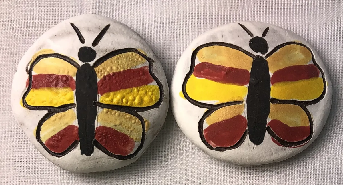 Clay rocks with butterfly pattern