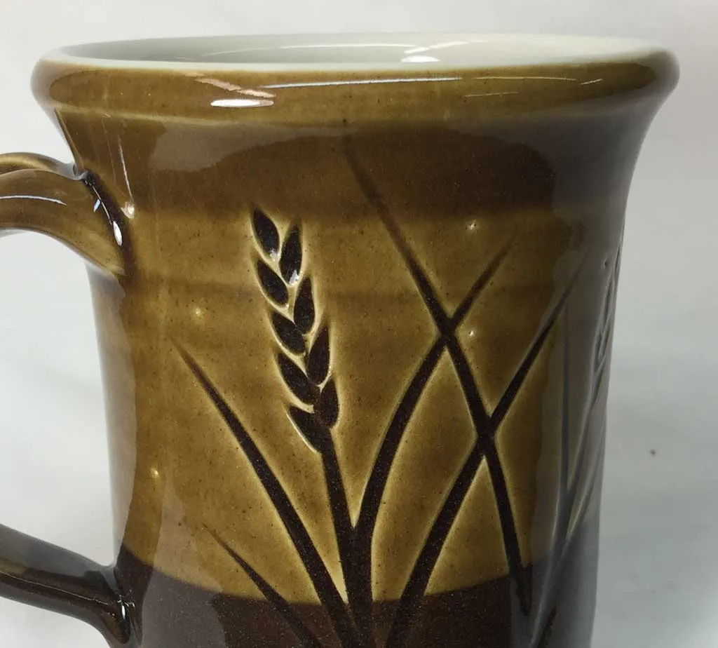 Pinholing at a cone 6 stoneware mug. Why?