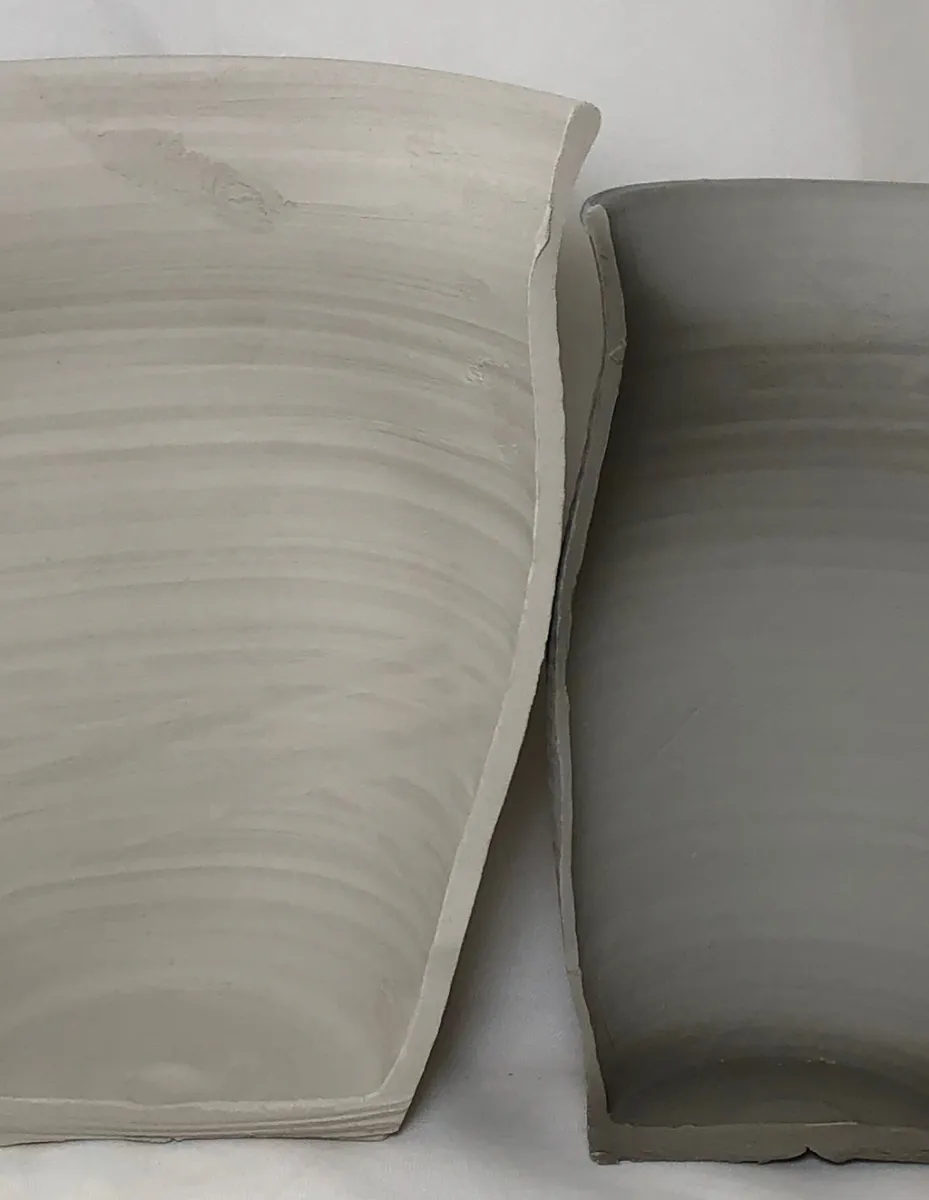 Two dissected vases showing the comparison in wall thickness