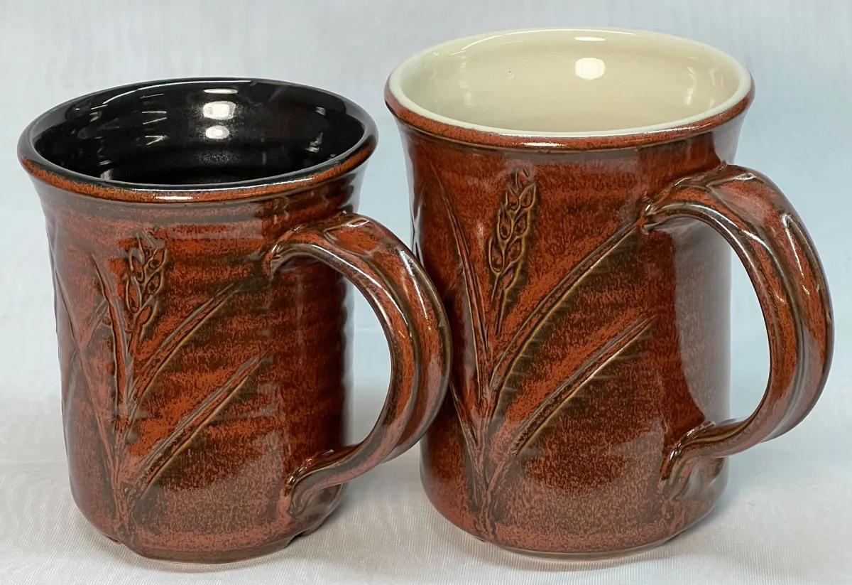 Two iron red mugs