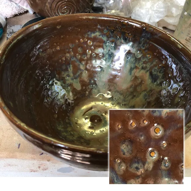 A runny glaze is blistering on the inside of a large bowl