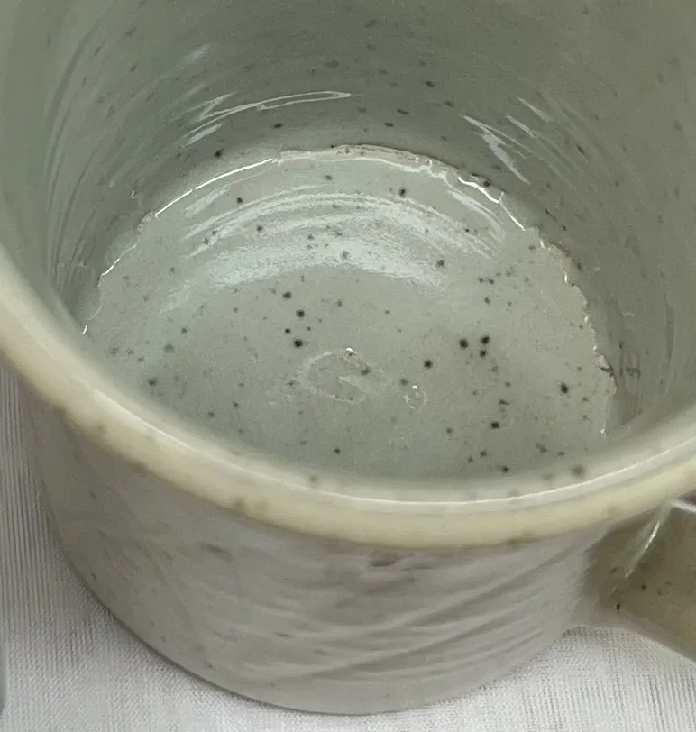 A glaze crawling inside a mug