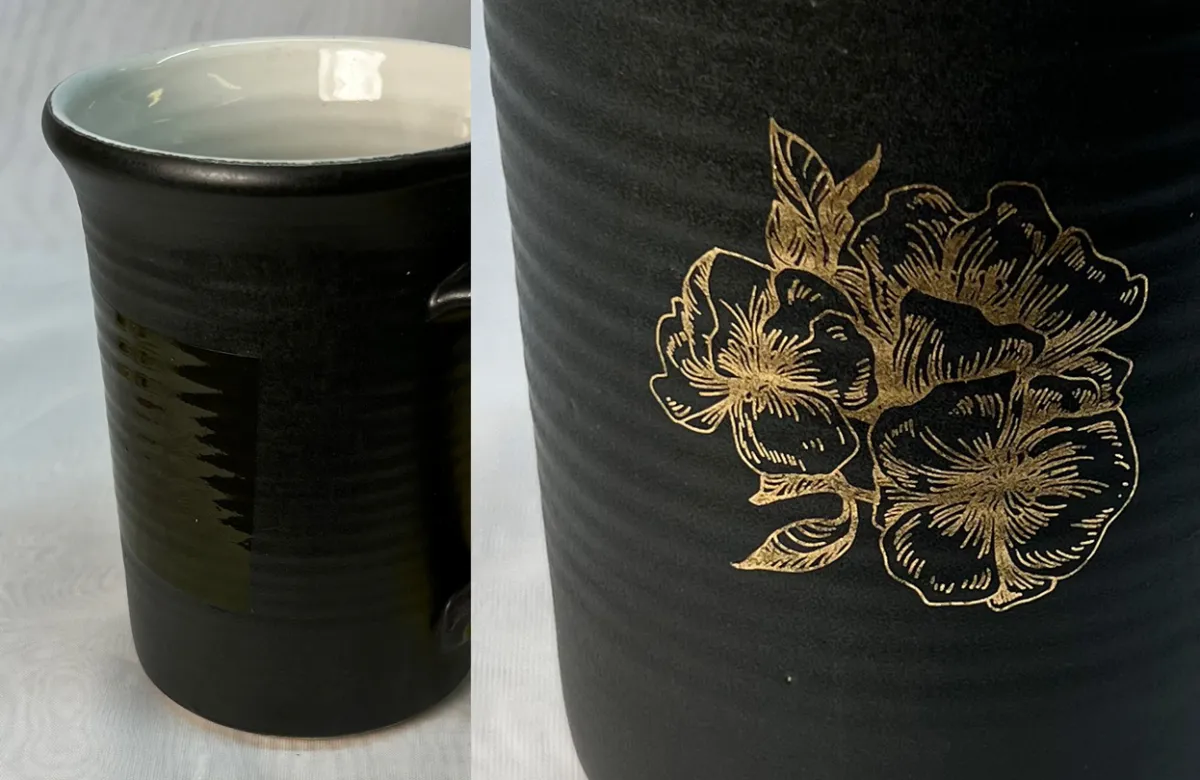 Black mug with gold flower