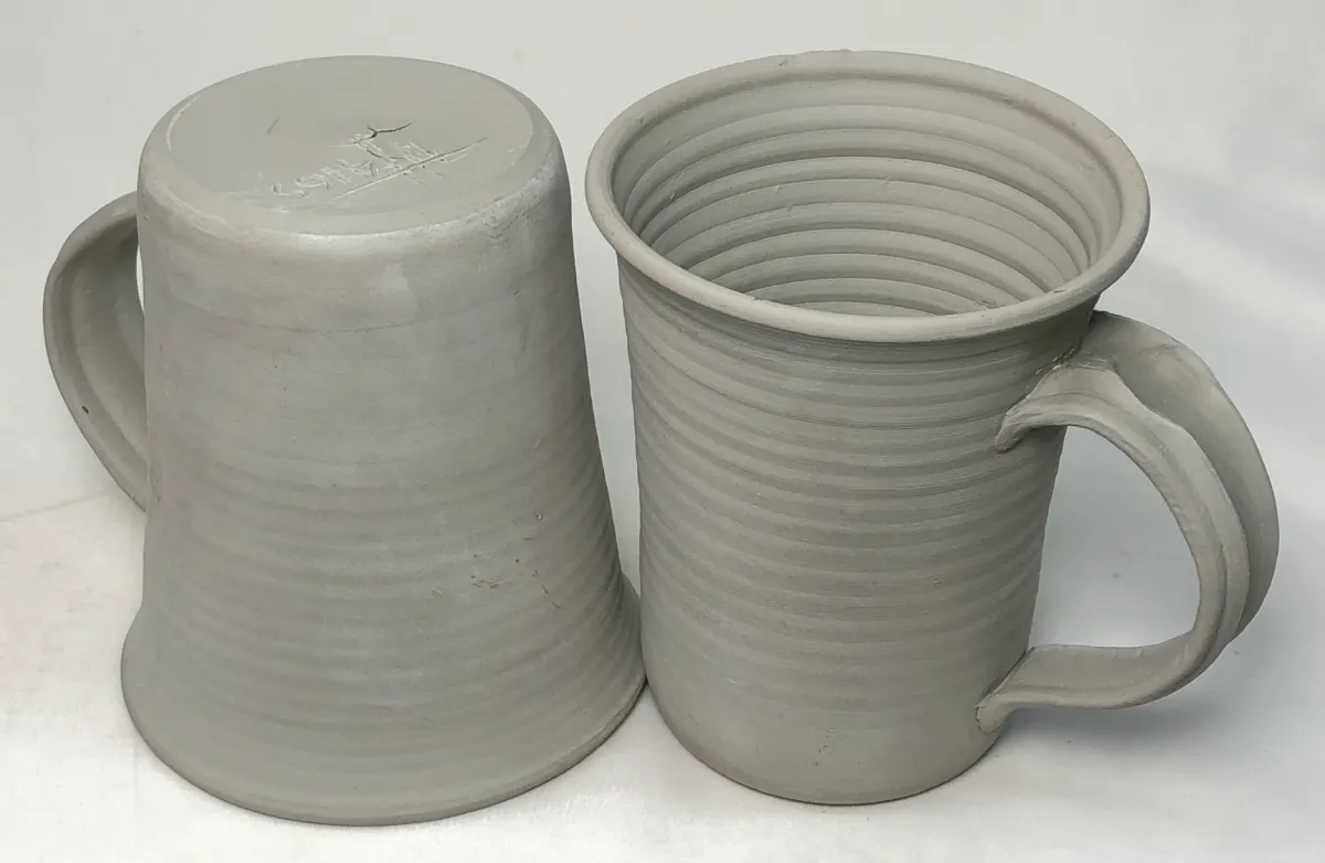 Two dried pottery mugs