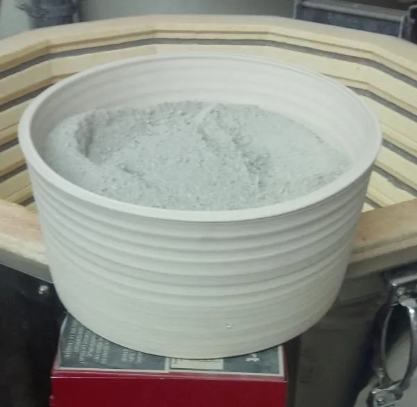 A bisque fired container of roasted Ravenscrap Slip powder